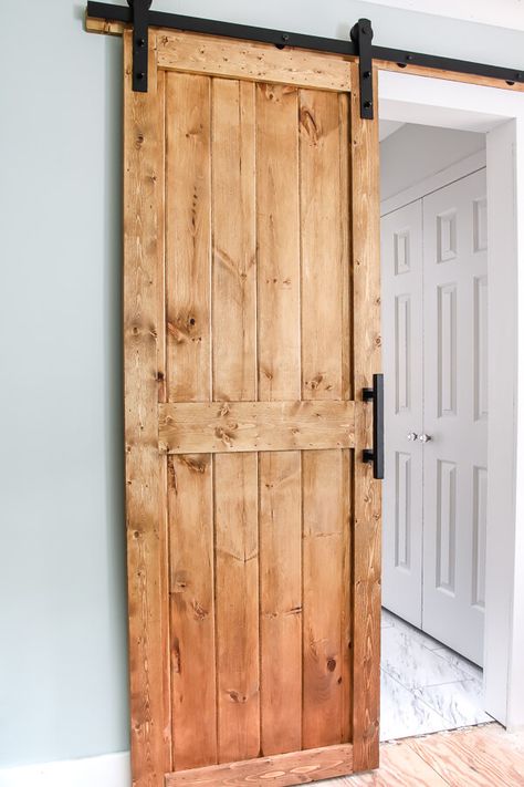 DIY barn door plans and tutorial. We snuck a little something on the back side of this door you have to see! #DIYbarndoor #barndoortutorial Diy Barn Door Cheap, Diy Barn Door Plans, Door Plan, Diy Sliding Barn Door, Diy Barn, Barn Door Designs, Diy Barn Door, Interior Barn Doors, Diy Door