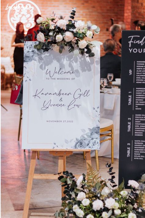 Customised welcome board with floral decoration on easel stand. Wedding Welcome Boards, Wedding Welcome Board Ideas, Welcome Board Ideas, Elegant Black And White Wedding, Simple Stage Decorations, Wedding Welcome Board, Engagement Signs, Welcome Board, Welcome Boards