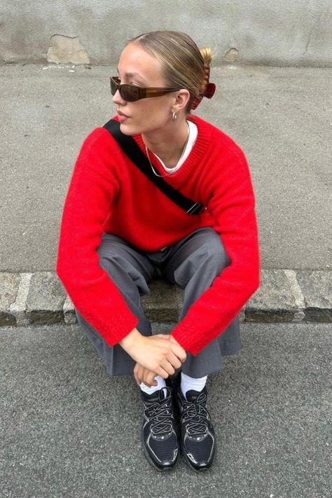 A women sitting on the pavement wearing an Autumn outfit, a red knitwear jumper Red Longsleeves Outfit, Red Crewneck Outfit, Red Pullover Outfit, Red Sweatshirt Outfit, Red Jumper Outfit, Red Tshirt Outfit, Red Vest Outfit, Knitted Jumper Outfit, Red Outfit Casual