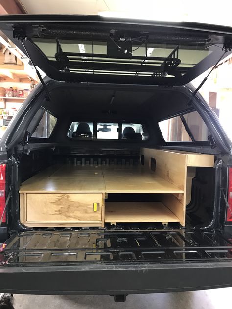 Truck conversion with full bed, shelve and storage underneath. Tacoma Sleeping Platform, Truck Bed Conversion, Toyota Tacoma Camping Truck Bed, Camper Shell Interior Ideas, Truck Bed Camping Setup, Interior Truck Ideas, Camper Shell Ideas, Diy Truck Bed Storage, Diy Truck Bed Camper