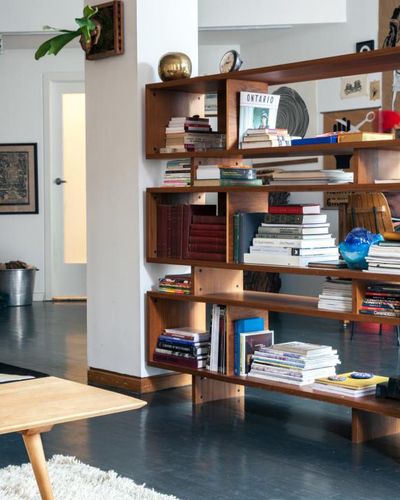 Have a large, open space that needs some privacy? This loft, originally seen on Remodelista, shows how a large bookcase is the perfect piece for the job. Room Divider Ideas Diy, Room Divider Diy, Bookshelf Room Divider, Mid Century Modern Bookcase, Fabric Room Dividers, Bamboo Room Divider, Modern Room Divider, Diy Room Divider, Muebles Living