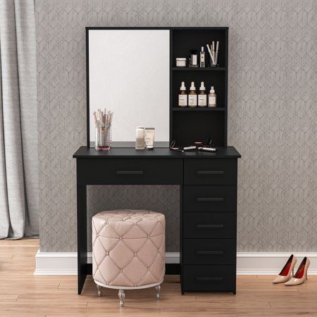 Bring a fresh and modern style into your Bedroom with The Boahaus Spes Modern Black Vanity Desk. Nothing is better than starting the day off looking fabulous with great makeup, and you can reach this with the Spes dresser for the bedroom with a mirror. This black makeup vanity is made from manufactured wood ensuring quality and longevity. This modern and unique piece features a smoked black finish that matches almost every dresser for bedroom dcor. The modern makeup table comes with an awesome Hollywood mirror that helps you see delicate details like eye makeup so you can feel like a movie star. With six drawers, one of them with a jewelry divider, and three lateral shelves theres ample space for a variety of brushes, beauty essentials, and accessories. This bedroom vanity with a mirror an Painted Makeup Vanity, Black Vanity Table, Black Vanity Desk, Modern Black Vanity, Painted Makeup, Black Makeup Vanity, White Vanity Desk, Modern Makeup Vanity, White Makeup Vanity