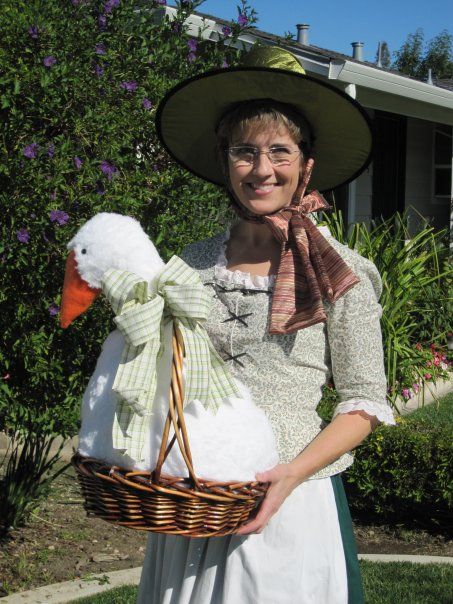 As a children's librarian, I wanted to be Mother Goose for Halloween.  I reused my colonial dress, altered a store-bought witch's hat, and made the goose (that was the biggest part!) Nursery Rhyme Costumes For Adults, Mother Goose Costume, Nursery Rhyme Decorations, Shrek Props, Creepy Nursery Rhymes, Nursery Rhyme Costume, Goose Costume, Parade Dress, Colonial Dress