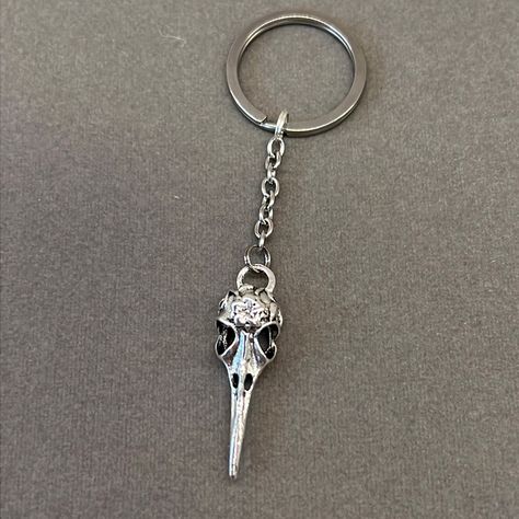 Handmade Boutique Antique Silver Raven Skull Keychain Gothic Style Silver Tone Raven Skull Approx 4” Overall Length On Curb Chain With 1.2” Flat Split Ring Raven Charm Approx 2” Length 3 For $20 As Part Of A Bundle My House Key Not Included Smoke & Pet Free Home Same Or Next Day Shipping Orders Placed Before 10am Pacific Standard Time Usually Ship Same Day Mon Thru Sat Check Out My Closet For Fun Add-Ons And Bundle Deals: Enamel Pins, Keychains, Charms, Socks, Free Stuff, Etc Go Happy! Goth, Gothic, Skeleton, Raven, Vulture, Bird, Avian, Crow, Norse Crow Keychain, Happy Goth, Vulture Bird, Keychains Charms, Gothic Skeleton, Louis Vuitton Keychain, Skull Keychain, Leather Lanyard, Raven Skull