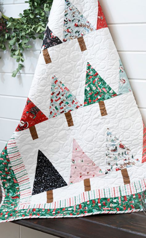Try this Easy Beginner Friendly Winter Pines Quilt Tutorial! This quilt is mighty pine! Piece a beginner-friendly Winter Pines Quilt using the Missouri Star pattern and cheery Twas fabrics by Riley Blake designer Jill Howarth. Christmas Tree Quilt Block Patterns Missouri Star Quilt, Christmas Trees Quilt Patterns, Natal, Patchwork, Peacock Quilt Pattern Free, Christmas Quilt Fabric, Christmas Quilt Patterns Easy, Quilting Projects Christmas, All Wrapped Up Quilt Pattern Free