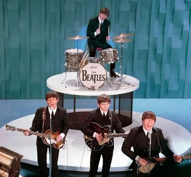 The Beatles made their U.S. television debut on the "Ed Sullivan Show" in New York on Feb. 9. 1964: From left, front, are Paul McCartney, George Harrison and John Lennon. Ringo Starr plays drums. Beatles Performing, Ed Sullivan Show, Ed Sullivan, The Ed Sullivan Show, Beatles Photos, Beatles Pictures, Drum Head, Musica Rock, The Fab Four