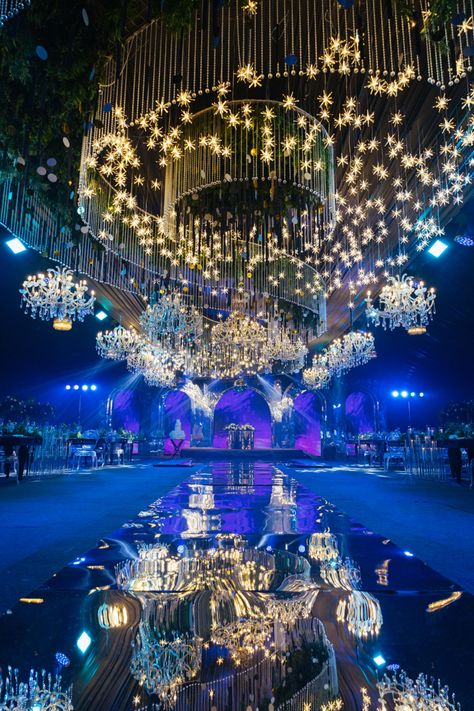 A stunning wedding reception decor featuring a custom-designed ceiling installation made up of crystals, stars and chandeliers. Wedding Decorations, Chandeliers, Wedding Receptions, Wedding Reception Decor, Ceiling Installation, Reception Decor, Crystal Wedding, Wedding Reception Decorations, Reception Decorations