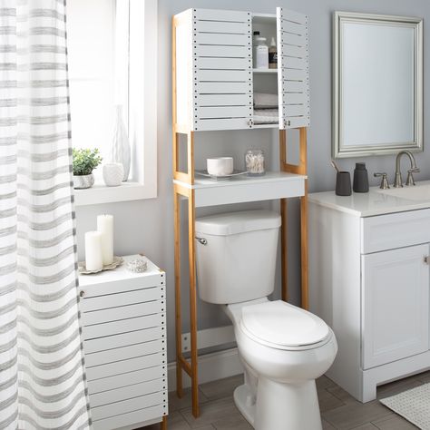 "This Organize It All Over the Toilet Space Saver Cabinet is stylish and functional for almost any bathroom. It adds 3 additional storage shelves to an otherwise unused area of the bathroom; above the toilet. This over the toilet storage cabinet is stylish and functional for almost any bathroom. It adds 3 additional storage shelves to an otherwise unused area of the bathroom; above the toilet. This cabinet is perfect for storing toilet paper, towels, and other bathroom essentials out of sight. T Toilet Furniture, Above The Toilet Storage, Toilet Space Saver, Ideas Baño, Freestanding Bathroom Shelves, Over Toilet Storage, Stacking Shelves, Bathroom Oasis, Over The Toilet Cabinet