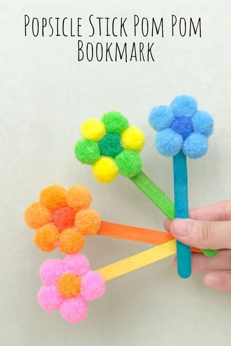 This easy popsicle stick pom pom bookmark is a great (and cheap!) way to give your kids a fun craft to make this summer! Pom Pom Bookmark, Easy Popsicles, Babysitting Crafts, Easy Easter Decorations, Toddler Arts And Crafts, Hand Crafts For Kids, Aktivitas Montessori, Easter Decorations Kids, Easy Arts And Crafts