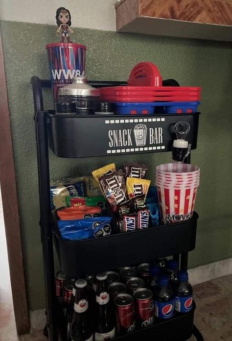 Viral Baby Products Diy Basement Movie Room, Gaming Room Snack Bar, Movie Theater Ideas At Home, Movie Theatre Living Room, Snack Station Basement, Media Room Popcorn Bar, Home Popcorn Bar, Movie Theatre Living Room Ideas, Home Movie Snack Bar