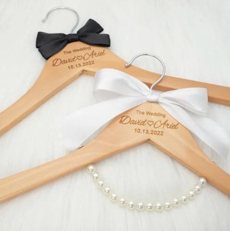 Make your special day even more memorable with our Custom Wedding Dress Hanger. This personalized bridal hanger features beautifully engraved names and date, adding a unique and sentimental touch to your wedding attire. It's not just a hanger; it's a cherished keepsake that will forever remind you of the love and joy of your special day. A perfect addition to your bridal preparations, this custom hanger also makes for a thoughtful and unique bridal shower gift. Surprise the bride-to-be with a personalized touch that she'll treasure as she gets ready for the big day. Celebrate love and commitment with our Custom Wedding Dress Hanger - a small detail that makes a big impact. Order now to add a touch of personalized elegance to your wedding experience or to gift a one-of-a-kind keepsake to th Unique Bridal Shower Gift, Bridal Hangers Personalized, Unique Bridal Shower Gifts, Dress Hangers, Bride Hanger, Custom Hangers, Bridal Hangers, Bridal Preparation, Wedding Shopping