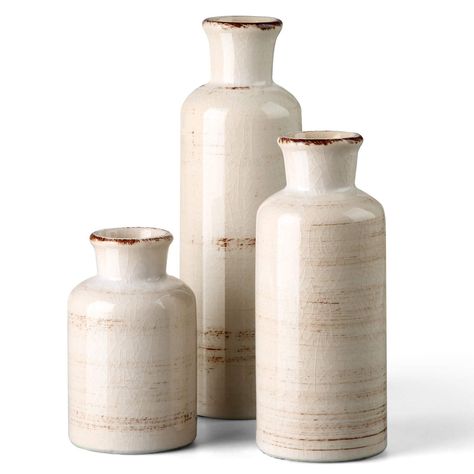 PRICES MAY VARY. Personalize your home furnishing-show off your style with this 3-piece decorative distressed beige ceramic vase. Create a space for your home with exquisite, rustic, elegant, relaxed and beautiful home decoration pieces. The elegant, yet simplistic look will be sure to add some rustic charm to your mantel, tabletop, shelf, or along-side your favorite décor pieces Quality Ceramic Made:This set of three petite Made of 100% high quality ceramics by hand, the vases have a good abili Joker Decorations, Beige Ceramic, Rustic Vase, Decorative Vases, Home Decor Sets, White Vase, Bohemian Colors, Vase Shapes, Table Kitchen