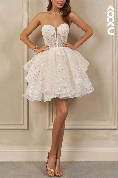 Say yes to this charming K2094 Mini Wedding Dress with gorgeous sparkles. A comfortable A-Line fit and square short sleeves create a stunning silhouette. Perfect for your special day, this dress will make you feel absolutely divine!! Sparkly Reception Dress, Short Beach Wedding Dress, Sparkly Short Dress, Sweet 16 Party Dress, Short Wedding Dress Beach, Special Outfits, Working Wall, Tiered Tulle Skirt, Homecoming Formal Dresses
