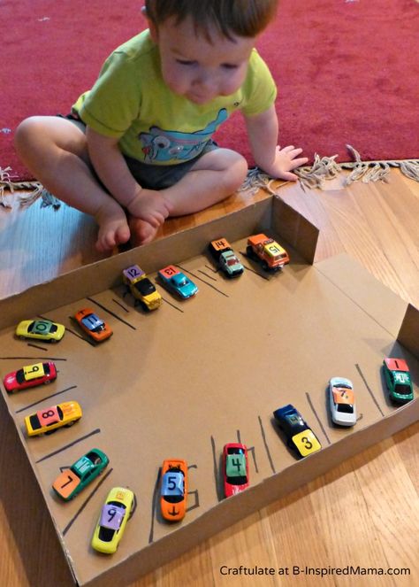 numbered cars and parking spots. fun learning activity for preschoolers. Handprint Unicorn, Diy Foosball, Aktiviti Prasekolah, Maluchy Montessori, White Marker, Unicorn Craft, Road Blocks, Colored Tape, Parking Spots