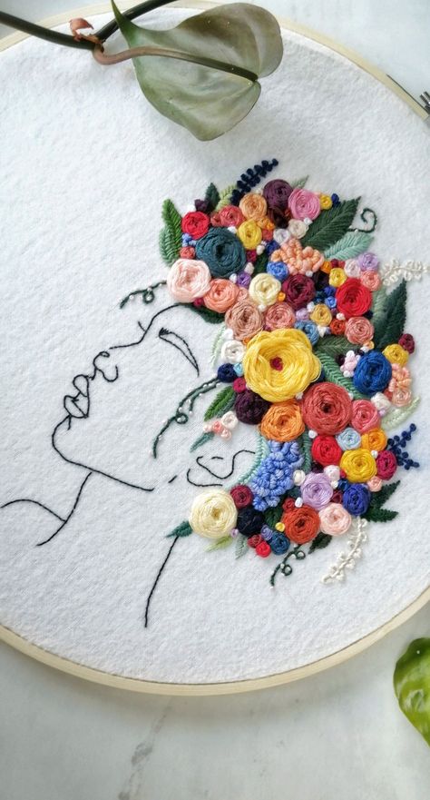 A Silhouette of a black woman with an embroidered flowerleaf and vine afro. Black Woman Embroidery, How To Embroider Hair, Valentine Embroidery Ideas, Afro Embroidery, Valentine Embroidery Designs, Flower Hair Crown, Valentines Embroidery Designs, Black Woman Afro, Embroidered Wall Art