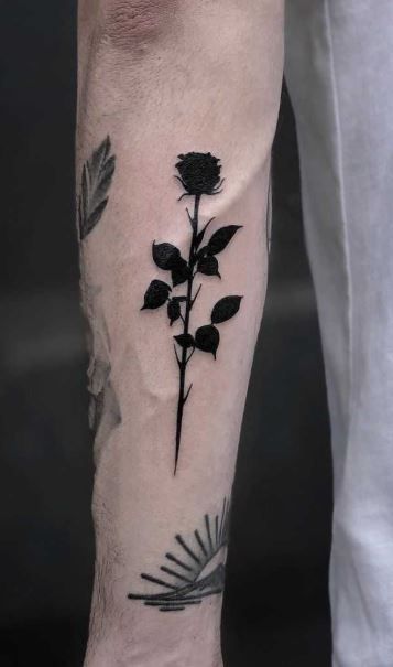 Tattoo Designs Rose Men, Rose For Men Tattoo, Rose Unique Tattoo, Men’s Rose Hand Tattoo, Black Ink Rose Tattoo, Black Out Design Tattoo, Withering Rose Tattoo, Black Out Rose Tattoo, Rose Wrist Tattoo Men