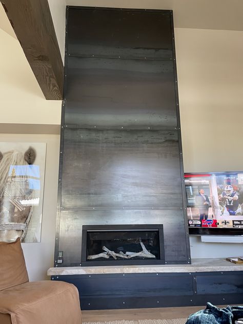 Metal wrapped fireplace wall Steel Clad Fireplace, Fireplace With Metal Surround, Steel Fireplace Wall, Wrapped Fireplace, Fireplace Feature, Fireplaces Ideas, Fireplace Feature Wall, Metal Fireplace, Neo Gothic