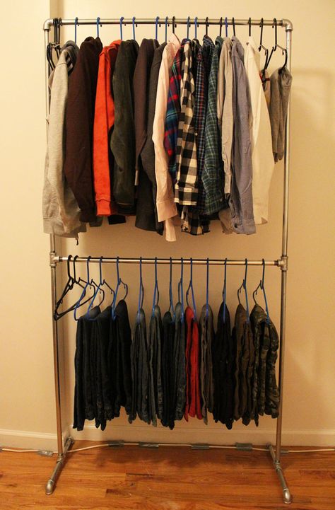 No closet? No problem! Check out how I built a wardrobe rack for my son's clothing using plumbing pipe. Yes that's right, plumbing pipe. This project is so easy that my little man could have practically built it himself and it looks totally rugged and cool! Read on for a step by step tutorial with pictures to help you build your own Pipe Clothing Rack, Pipe Clothes Rack, Garderobe Diy, Family Closet, Hanging Clothes Racks, Pipe Rack, Diy Clothes Rack, Galvanized Pipe, Diy Pipe