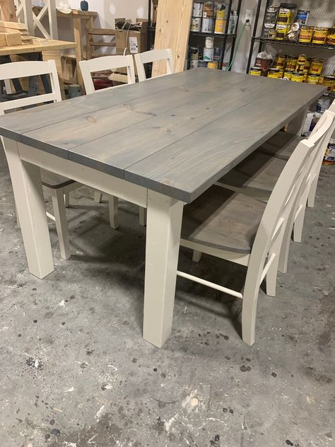 Bring this rustic 6.5ft farmhouse table into your home today. This dining set comes with six chairs. This table set has chunky legs to really give it that farmhouse feel. The top is a classic gray while the base is a antique white. This set has a matte poly finish to protect the paint, stain, and wood. Chairs are made to match. Gives the perfect option for small dining. The table sits at 6.5ft x 37 x 30 The chairs are not handmade but refinished to match the table set. Shipping Info We ship nati Industrial Farmhouse Table, Farmhouse Table With Bench, Dining Table Makeover, Grey Dining Tables, Wooden Dining Set, Farmhouse Dining Room Table, Rustic Farmhouse Table, Kitchen Table Makeover, Stained Table