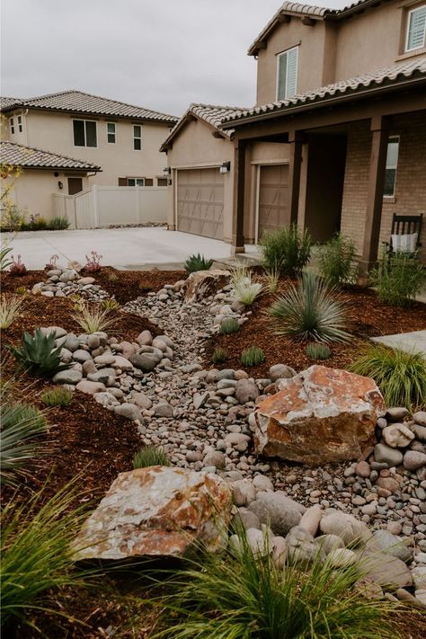 Dry Stream Beds are the perfect low maintenance landscape design. See the full yard transformation of our Río Sueño Project here!

River Rock Garden, Dry Riverbed Landscaping, River Rock Landscaping No Grass Yard, Dry Stream Bed, Dry Riverbed Landscaping, Dry Stream, Xeriscape Front Yard, Stream Bed, River Rock Garden, Rock Bed, Drought Resistant Plants