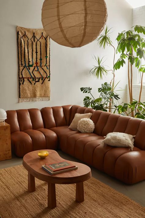 Modern Natural | Midcentury Modern Furniture | Urban Outfitters 70s Penthouse Apartment, Leather Sofa With Accent Chair, Big Leather Couch, Small Mediterranean Living Room, Midcentury Modern Leather Couch, Gold And Wood Living Room, Styling A Leather Couch, Conversational Couch, Modular Leather Sofa
