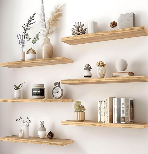 PRICES MAY VARY. Real Wood Floating Shelves: Crafted from solid wood for a durable and sturdy design. PHPH wood floating shelves with natural wood grain give a rustic feel to any space. Modern Rustic floating shelves: PHPH modern rustic floating shelves provide a industrial look that will blend well with modern and farmhouse wall decor alike. You are sure to make a welcome addition and a warm touch to your bathroom, kitchen, bedroom, or living room. Display Decor Floating Shelves: The rustic flo Floating Shelf Designs, Floating Shelves Over Dresser, Living Room Shelves Decor Ideas, Floating Office Shelves, Floating Shelves Above Dresser, Wooden Shelves Living Room, Desk With Shelves Above, Light Wood Shelves, Floating Shelves Office