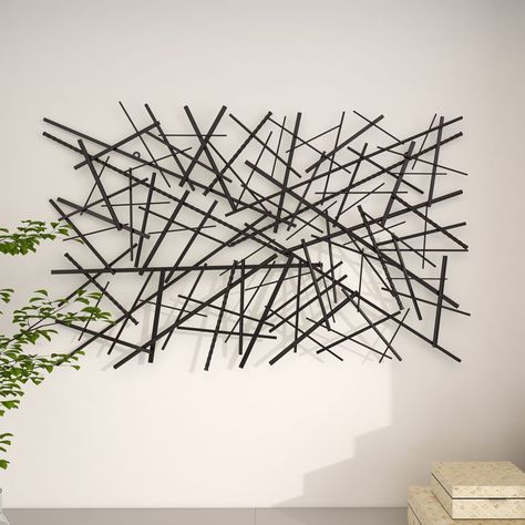 The crosshatched design and multiple textures of this metal wall decor brings abstract art motion to your walls. Full of dimension, this black metal wall art suits modern and contemporary style spaces and is easy and ready to horizontally hang by the O-ring hardware in the back. Suitable for indoor use only. This item comes shipped in one carton. Grayson Lane 2-in W x 30-in H Metal Abstract Wall Accent | 56914 Decorative Wall Sculpture, Grey Wall Decor, Black Metal Wall Art, Abstract Metal Wall Art, Lines Abstract, Wall Accent, Nails And Screws, Abstract Wall Decor, Gold Walls