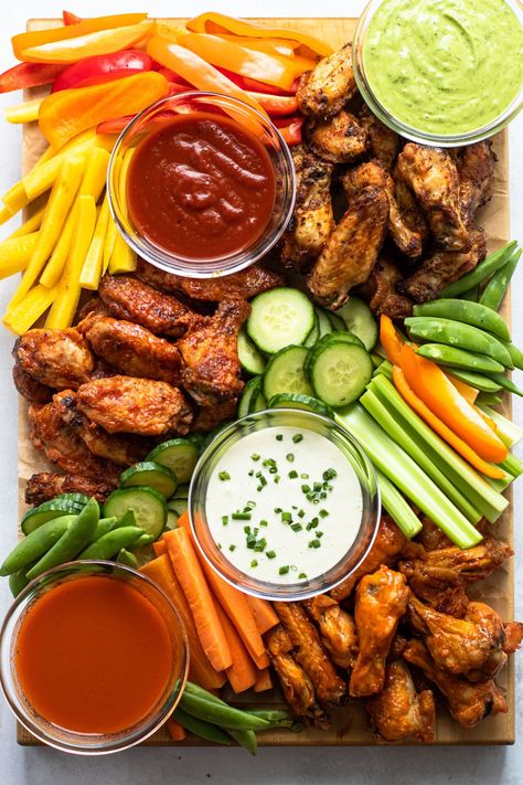 I'm all about a good charcuterie board, but have you ever thought to make one with chicken wings? It's a genius idea, and one that is perfect to showcase the fan-favorite crispy chicken wing! Aperitif, What To Serve With Wings, Wing Charcuterie Board, Charcuterie Party, Crispy Chicken Wings, Charcuterie Inspiration, Party Food Platters, Charcuterie And Cheese Board, Charcuterie Recipes