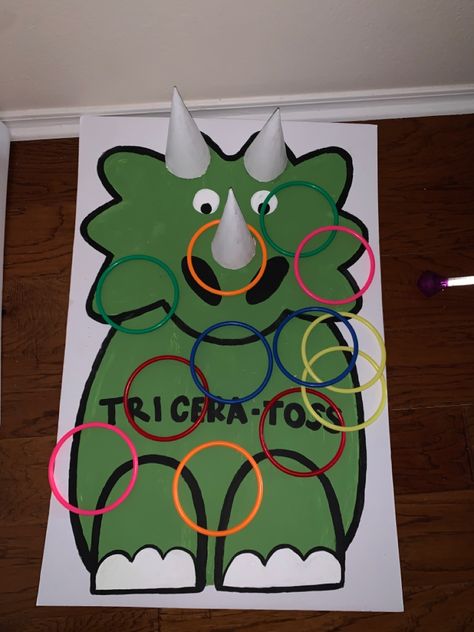 Dinosaur Ring Toss, Dinosaur Theme Table Preschool, Pin The Dinosaur Game, Triceratops Ring Toss, Diy Dino Decorations, Dinosaur Backdrop Ideas Diy, Diy Pin The Tail On The Dinosaur, Dino Scavenger Hunt, Outdoor Dinosaur Activities