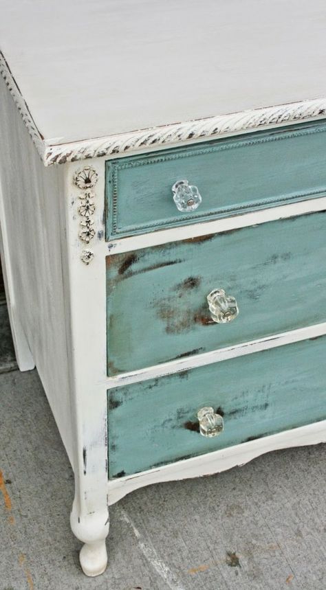 Start gently at first with your sander. You don’t want to take off too much paint. But you can always take off more if you need to! Use a power sander and experiment with different grits to get different looks. White Dresser With Painted Drawers, Shabby Chic Tv Stand Ideas, Turquoise Chalk Paint Furniture, Beach Dresser Makeover, Beachy Dresser Makeover, Chalk Painted Dresser Ideas, Refurbished Dresser White, White Chalk Paint Furniture Distressed, Teal Dresser Makeover