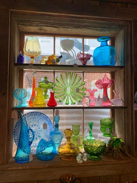 colored glass collection Rainbow Vintage Glassware, Thrifted Colorful Glasses, Rainbow Glassware Display, Colorful Glass Vases Decor, Colorful Glass Plates, Glass Bottle Collection, Glass Bottle Display Ideas, Colored Glass Plates, Colored Glass Collection