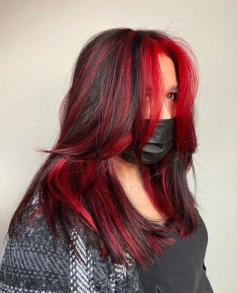 Flaming Beauty: Chic Hairstyles That Enhance Your Red Locks Red Dyed Tips On Black Hair, Black Hair With Red Highlights Layers, Brown Hair With Multi Colored Highlights, Bright Red Hair Highlights, Black Hair With Red Highlights Bangs, Bright Red Hair With Black Highlights, Red Highlights In Brown Hair Layers, Red And Blue Streaks In Hair, Red Vivid Hair