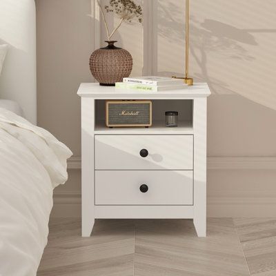 This product is a great companion for any bedside. The design features clean rectangular lines, rounded drawer handles, and a bright white finish. Decorate the top surface of the nightstand with a warm lamp, and the top shelf can be used for extra storage. All your items will be stored in two ample storage drawers to keep your bedroom clean and tidy. | Mercer41 21.7" Tall 2 - Drawer Nightstand in 21.7 H x 19.7 W x 15.7 D in brown / Wood in White | 21.7" H X 19.7" W X 15.7" D | Wayfair Cool Bedside Tables, White Oak Nightstand, Decorative Items For Bedroom, Warm Lamp, Chambre Inspo, House Bedroom Ideas, Bedside Table Decor, White End Tables, White Room Decor