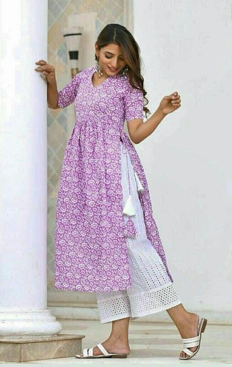 Woman outfit|cotton kurti|purple colour Kurti Designs With Sleeves, Side Lace Kurti, Kurti With Tassels, Cotton Stylish Kurtis, New Kurti Designs Cotton, Nyra Dress Design, Ladies Kurties Design, Plazzo Kurti Design, New Kurti Designs 2023 Latest Cotton