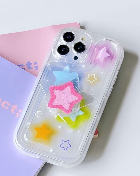 New In! Pretty Aesthetic Y2K Stars iPhone Case 🔗 📱 SOFT PHONE CASE ++ Brand New ++ High Quality Premium TPU ++ Perfect Snug Fit ++ Raised edges protect screen and camera 📱 Available Devices: iPhone 15 Pro Max, iPhone 15 Pro, iPhone 15 Plus, iPhone 15, iPhone 14 Pro Max, iPhone 14 Pro, iPhone 14 Plus, iPhone 14, iPhone 13 Pro Max, iPhone 13 Pro, iPhone 13, iPhone 12 Pro Max, iPhone 12 Pro, iPhone 12, iPhone 11 Pro Max, iPhone 11 Pro, iPhone 11 How to order this case? —> Visit our website “... Y2k Stars, Y2k Glitter, Y2k Phone, Star Phone Case, Iphone Life Hacks, Branded Phone Cases, Iphone Obsession, Pretty Iphone Cases, Pretty Phone Cases