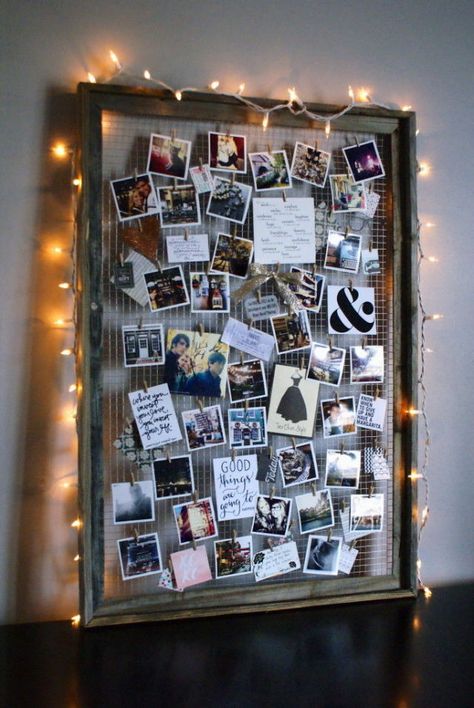 By removing the glass interior and adding wire, you can elevate an old frame into a beautifully crafted photo collage-esque display. Bonus: Add string lights around the frame to create a soft glow. Get the tutorial at Anastasia Co.   - CountryLiving.com Projek Kayu, Photo Collage Diy, Diy Dorm Decor, Diy Dekor, Polaroid Wall, Dorm Diy, Old Picture Frames, Hemma Diy, Room Decor Diy