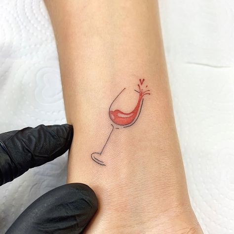 CafeMom.com : Tiny Tribute Tattoo : 20 Wine Tattoos We Happily Raise a Glass To -- A small tribute to wine can still show a big love for the good stuff. This tiny tattoo has just a splash of color (pun totally intended) and is small enough to easily be hidden, depending on the location. The style is also notably simple, but it still is executed perfectly. Tattoo Inspiration, Wine Tattoos, Wine Glass Tattoo, Wine Tattoo, Glass Tattoo, Tribute Tattoos, Food Tattoos, Bottle Tattoo, Coffee Tattoos