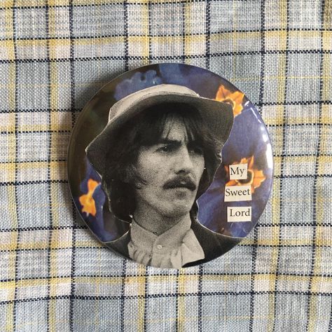 Unique large handmade badge made by Conor Clements. Created with vintage imagery of musician George Harrison with primroses and song lyrics my sweet lord. George Harrison, Song Lyrics, Sweet Lord, Handmade Collage, Button Badge, Pin Badges, Favorite Things Gift, Labour Day, Musician