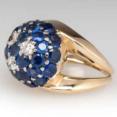 This incredible vintage dome cocktail ring features large blue sapphires with diamonds. The 28 sapphires total 4.7 carats and the three diamonds total .51 carats. The ring dates from the 1940's and features a fantastic split shank design. The ring is crafted of 14k yellow gold and is currently a size 6.75. We offer complimentary resizing to fit. Antique Cocktail Ring, Favorite Engagement Rings, Gorgeous Rings, Blue Sapphire Diamond, Ring Blue, Engagement Ring Styles, Split Shank, Blue Jewelry, Blue Sapphire Rings