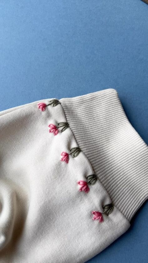 Spring Blooms 🌷 . . #sustainableclothing #handmadestyle #embroideryinstaguild #dmcembroidery #sewing #embroideryart #embroideryhoop… | Instagram Simple Embroidery Designs Hoodie, Embroidery Designs Words, Easy Clothing Embroidery Ideas, Cute Embroidery Tshirt, Simple Cute Embroidery Designs, How To Embroider Shirts By Hand, Tshirt Design Embroidery, Cute Embroidery Clothes, Simple Embroidery Projects