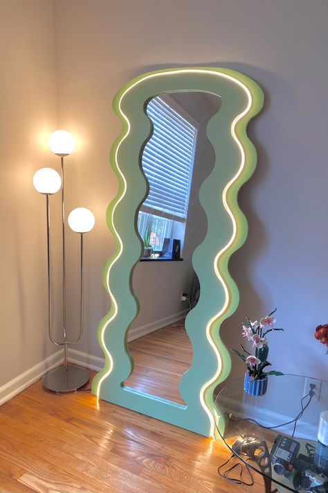 Sage green decor. LED decor. Wavy mirror. Fall home decor. Curvy Glow Mirror, Pastel Eclectic Bathroom, Wiggly Mirrors, Home Decor Funky, Mirror Maximalist, Colorful Bedroom Aesthetic, Funky Mirror Ideas, Bedroom Funky, Espejos Aesthetic