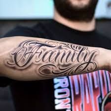 Top 250 Best Lettering Tattoos (October 2019) • Tattoodo Lettering On Forearm Tattoo, Family Words Tattoo, Last Name Tattoos For Women, Forearm Tattoo Men Name, Family Tattoo Ideas Men, Forearm Name Tattoos Men, Family Tattoos For Men Arm, Family Tattoo Forearm, Word Tattoos For Men Forearm