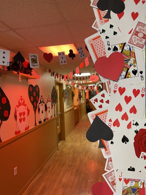 Queen of Hearts- Playing card banners, Queens Guard and Rose bushes. Red Queen Decorations, Queen Of Hearts Halloween Decorations, Queen Of Hearts Themed Party, Hallway Decorating School Homecoming, Queen Of Hearts Party Decorations, Casino Homecoming Theme, Queen Of Hearts Decor, Queen Of Hearts Party Theme, Queen Of Hearts Decorations