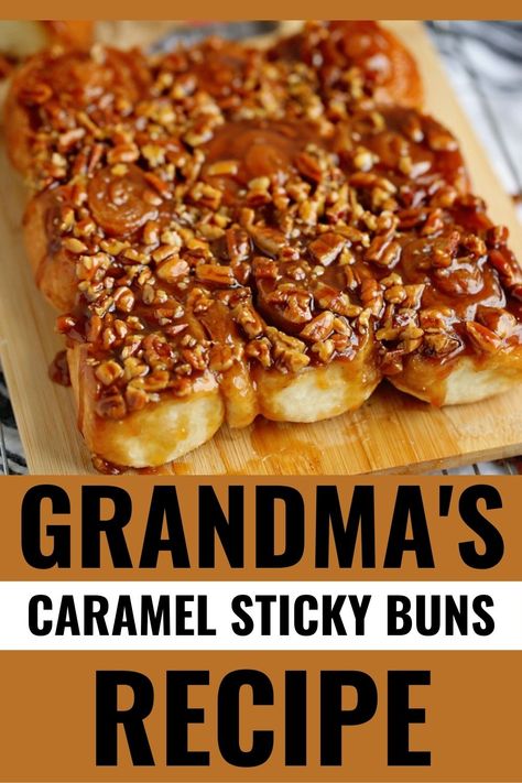 Delicious caramel sticky buns on wooden board.