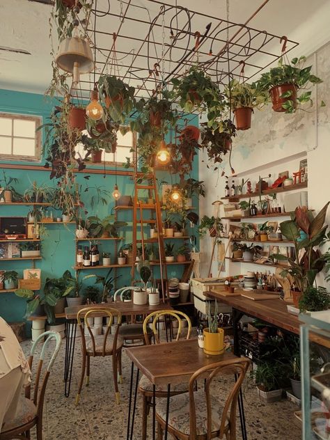 Witchy Coffee Shop Aesthetic, Aesthetic Cafe Interior Pastel, Magical Cafe Interior, Cottagecore Cafe Exterior, Coffee Shop And Boutique, Coffee Shop Flowers, Rustic Cafe Aesthetic, Fairy Coffee Shop, Colourful Coffee Shop