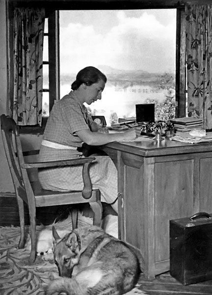 12 Famous Authors at Work With Their Dogs | Literary Hub Writers And Poets, Rumer Godden, Indian Proverbs, Dove House, Four Rooms, Women Writing, Writing Space, House Book, Famous Authors