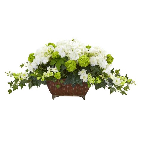 "Buy the 15.5\" White Hydrangea & Ivy Arrangement in Metal Planter at Michaels. com. This magnificent artificial hydrangea and ivy arrangement features elegant white flowers and ball-shaped soft green flowers blossoming in every direction. This magnificent artificial hydrangea and ivy arrangement features elegant white flowers and ball-shaped soft green flowers blossoming in every direction. This lovely piece is fixed in a brown metal planter where it's dark green ivy leaves are spilling out. Wi Tabletop Floral Arrangements, Hydrangea Centerpiece, Hydrangea Arrangements, Fake Plants Decor, Green Ivy, Artificial Hydrangeas, Silk Floral Arrangements, Artificial Flowers And Plants, Metal Planters