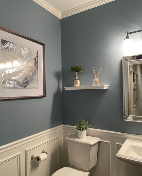 Blue bathroom with wainscoting and crown molding Light Blue Restroom Ideas, Bathroom 2 Color Walls, Grey Blue Paint Bathroom, Bathroom Inspo Wall Color, Nice Bathroom Colors, Sherman Williams Blue Grey, Light Blue Bathroom Walls Paint, Blue Grey Paint Bathroom, Dark Grey Blue Bathroom