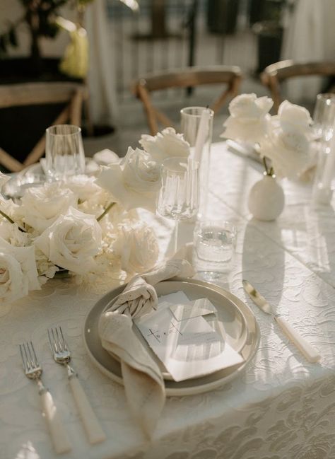 White Table Cloths Wedding Round, Cream Neutral Wedding, Black Chandelier Wedding, Neutral Palette Wedding Decor, Creamy White Wedding Flowers, Ivory Reception Tables, Ivory And White Table Setting, White Tablecloth White Napkin Wedding, Textured Linens Wedding