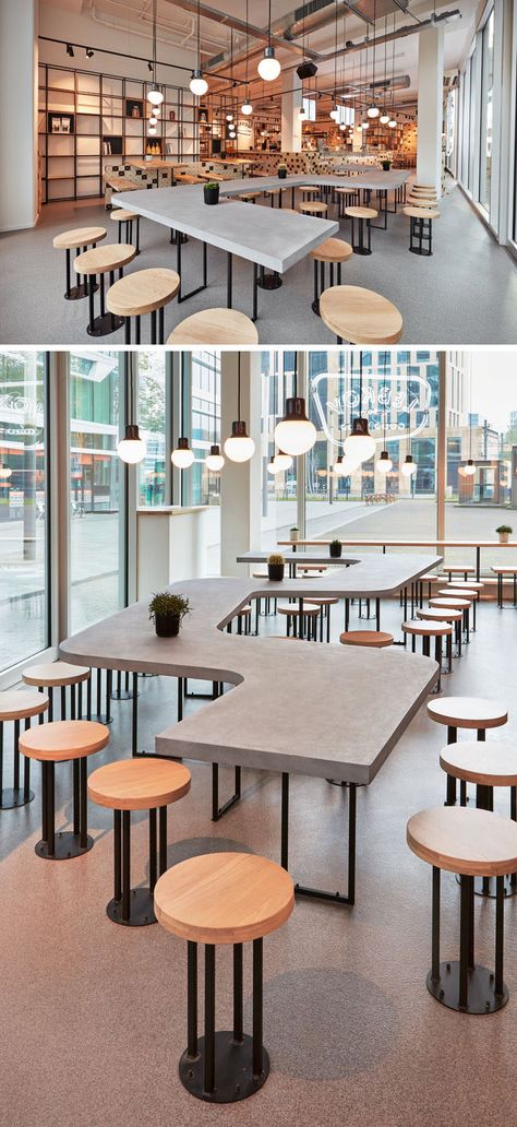 This modern cafe features a a snake-like, concrete shared table along the facade. #CafeDesign #TableDesign #CafeTable #CoffeeShop #CommunalTable Café Design, Kursi Bar, Communal Table, Modern Cafe, Coffee Shops Interior, 카페 인테리어 디자인, Table Cafe, Coffee Shop Design, Cafe Tables